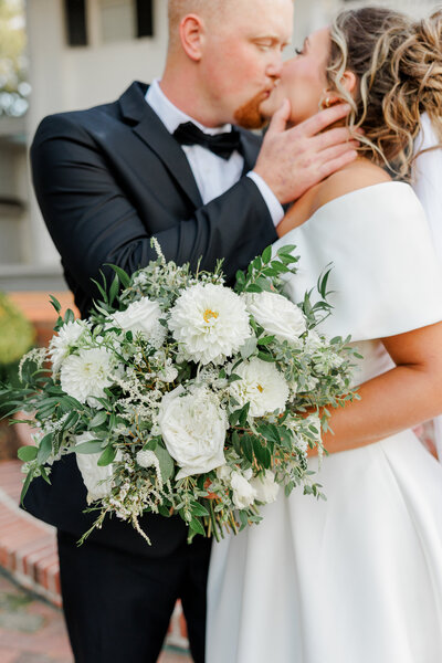 Couple embracing on porch of building
