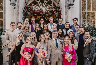 wedding guest photo on the steps at Chelsea town hall London
