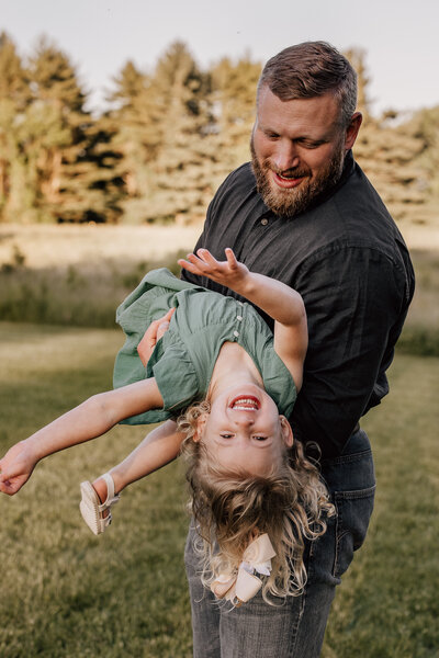 dad tickling daughter