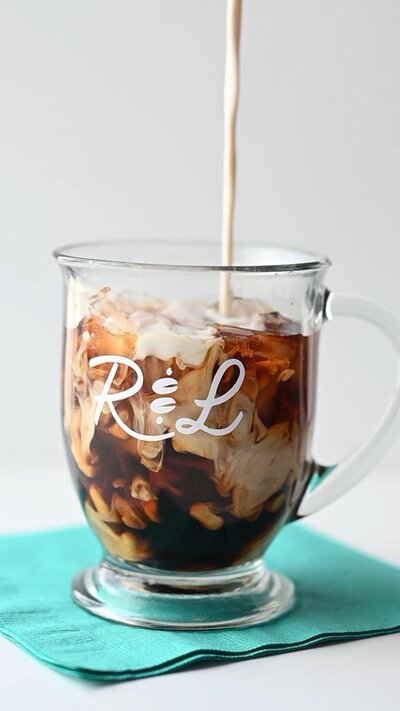 cream being added to cold brew from Rose and Lois
