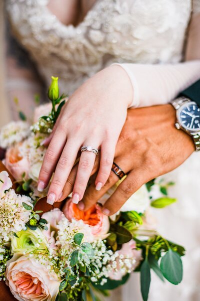 Julia Romano Photography Flagstaff wedding rings bride groom bouquet Serendipity Venue The Gardens at Viola's