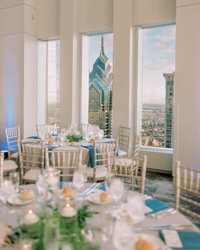 A wedding reception with views looking out over a city skyline 