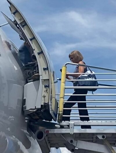 Lora boarding a plane