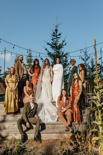 Full Bridal Party Posing in Mixed Colored Dresses & Suits - Megan & Amber | Hood River Wedding  - LGBTQ Wedding