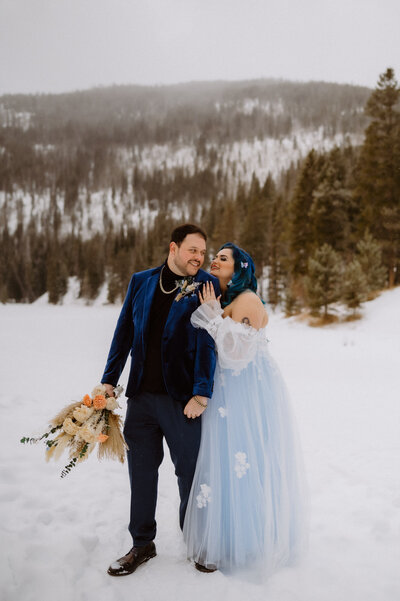 couple in the snow celebrating a winter elopement in Rocky Mountains