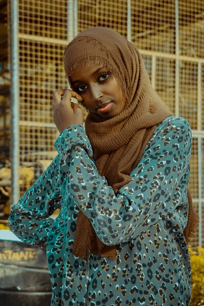 Somali girl in brown hijab with blue long sleeve shirt