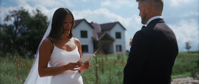 Bride reading vows to groom 