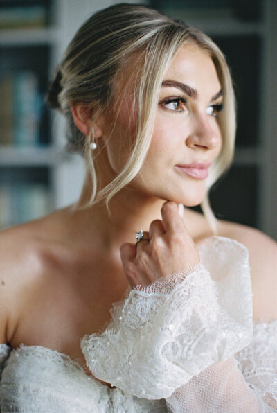 bride in bridal suite looking out window
