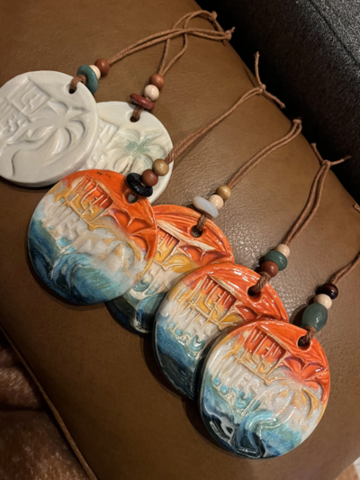 Jill stands beside a table of her pottery on display at the Studios of Key West in Key West, FL during a monthly art walk featuring more than 25 local businesses and artists in the White Street Gallery District