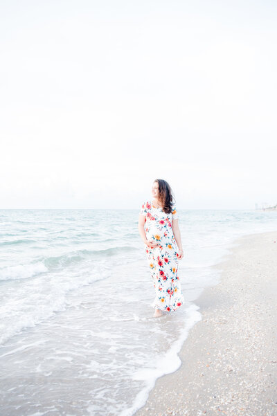 maternity session mom holding her belly at the beach ocean shore miami maternity photography by msp photography david and meivys