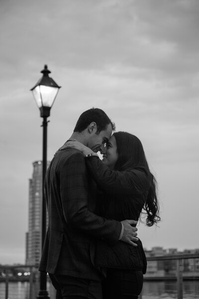 engaged couple twirling in front of Cylburn Mansion