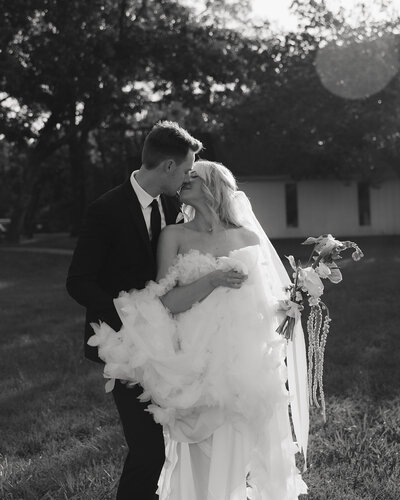 groom picks up bride on Rosemary beach