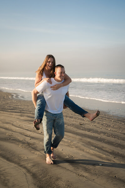 Couple on beach in San Diego, California for maternity photos