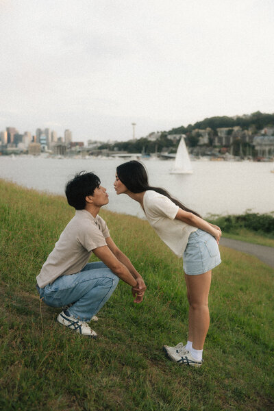 Couple embracing in a sunlit kitchen on Vancouver Island, captured by Rae Terrillon Photography
