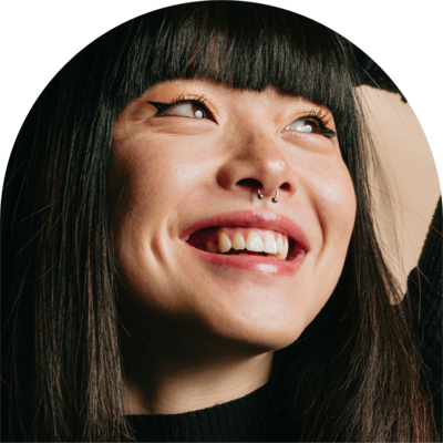 asian woman with bangs smiles