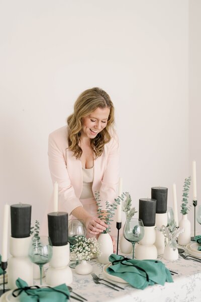 Lacey arranging florals on a table