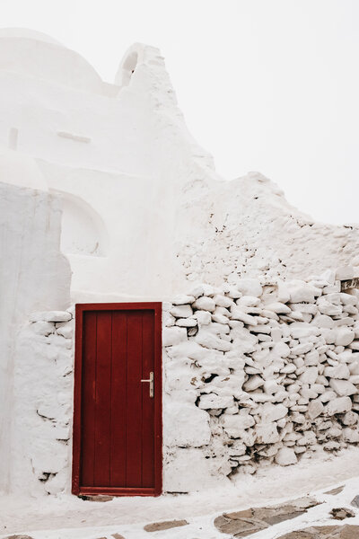 white building with a red door