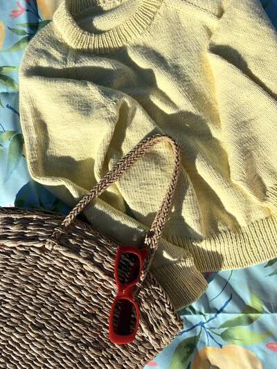 FO Monday Sweater in a flat lay at the beach