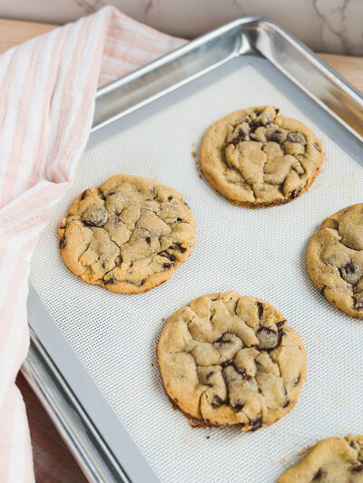 Fresh-from-the-oven chocolate chip cookies exemplifying our bakery’s dedication to quality.