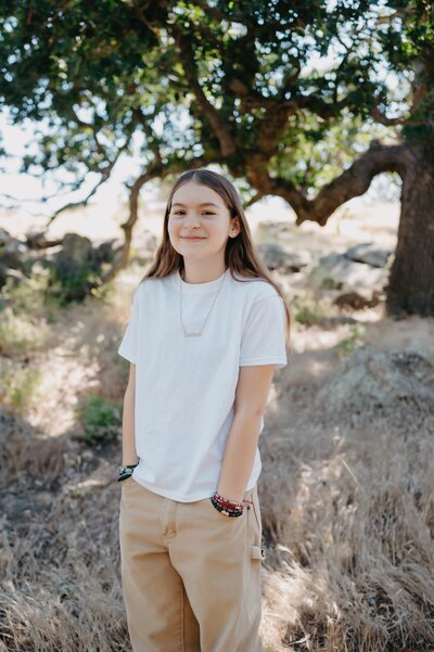 Rachael is the youngest daughter of Victor Polina and Marianne Lucas Los Angeles wedding photography team. Rachael is wearing  off white knit sweater with skinny blue jeans.