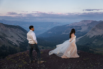 couple walking through trees taken by Minnesota wedding photographer Marcus Hanenburg Photography