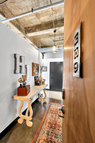 Entry way in this two-bedroom, two-bathroom vacation rental condo in the historic Behrens building in downtown Waco, TX just blocks from the Silos, Baylor University, and Spice Street.