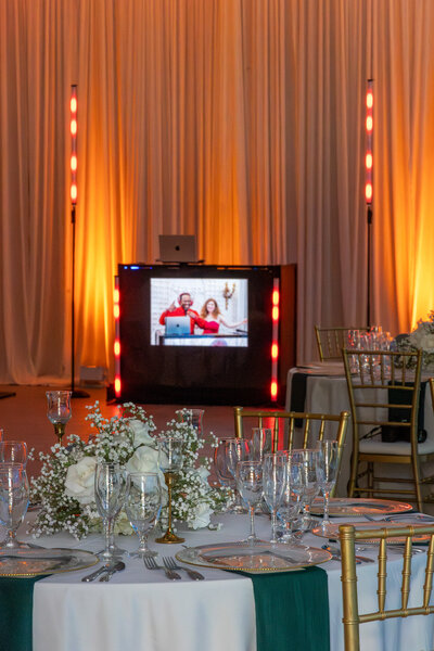 Elegant photo booth setup with glam lighting and floral decor at Chicago wedding reception