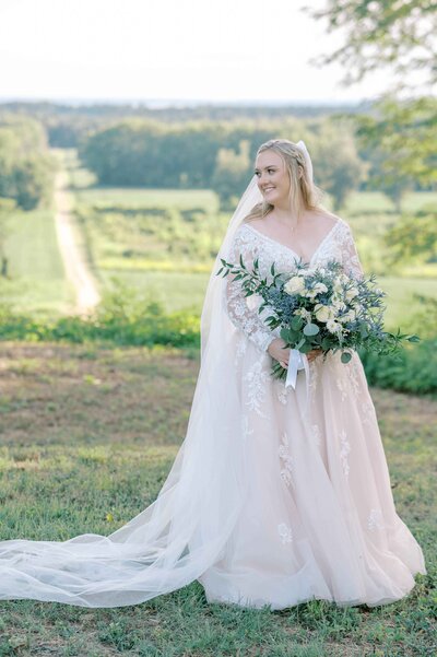 Bride holding her bouquet while  looking down