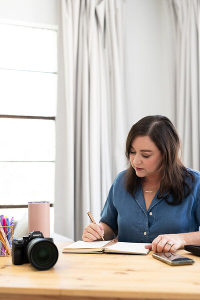 Christian business mentor for women at a desk working