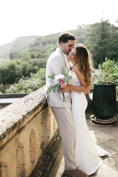groom-holding-bride-at-luxury-destination-wedding-in-port-grimaud