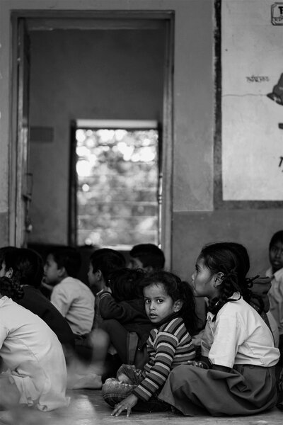 Girls sitting on floor in classroom