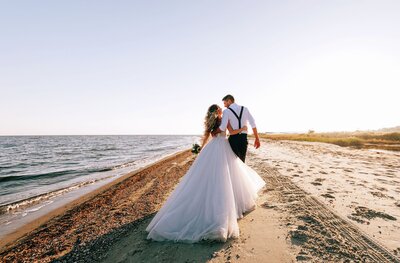 San Diego bride and groom walking on beach