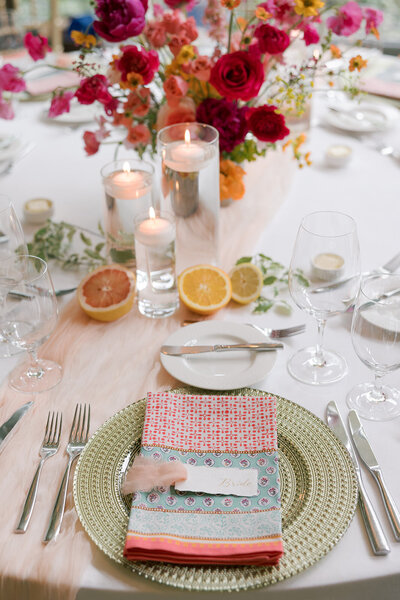 northern va wedding with colorful citrus theme tablescape with handwritten deckled edge calligraphy place cards