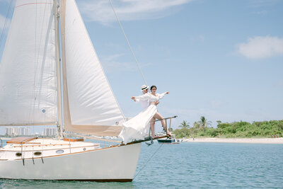 Bride and Groom on a sailboat by Miami Elopement Photographer