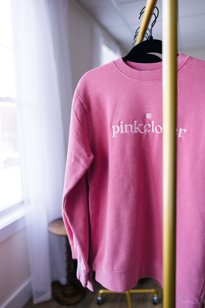 brunnete woman wearing cozy sweater smiling for camera