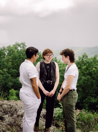 Black and white portrait of bride and groom in the mountains, styled in a documentary editorial aesthetic.
