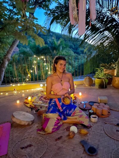 Sol Luciana facilitating a sacred cacao ceremony in Sayulita, guiding participants through meditation, drumming, and heart-opening connection for inner exploration and community bonding.