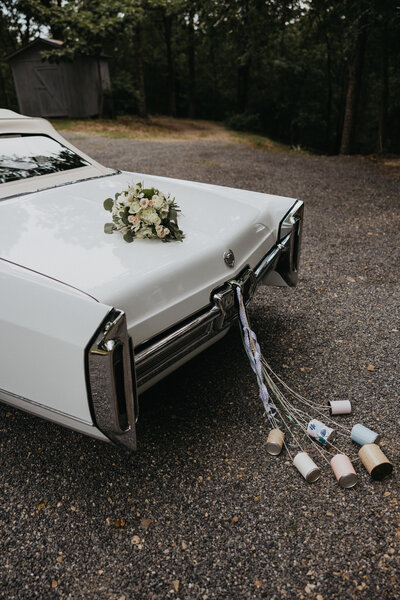 Cans dragging on wedding exit car