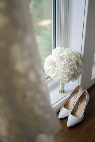 Stunning natural flower bouquet and the bride's luxurious shoes