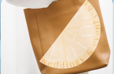 mockup of girl carrying a leather bag with a branded logo for her small business