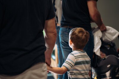 A child smiling at the camera in kids ministry