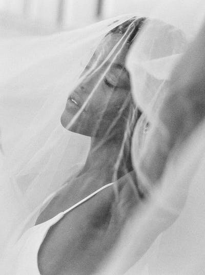Soft and emotional veil portrait of bride, captured by Seattle Wedding Albums & Fine Art Photography expert.