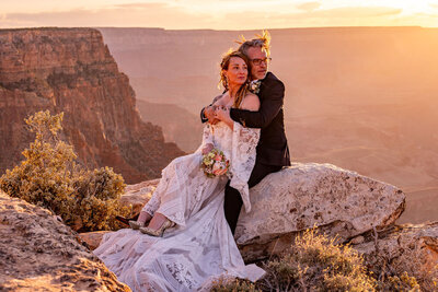 A couple exchanging vows with stunning views of the Colorado River winding through the Grand Canyon below them.