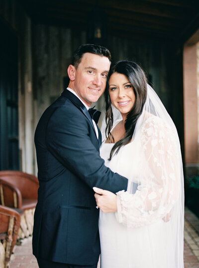 Engagement photography of couple holding hands walking down stairs.