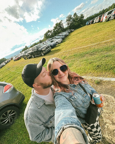 Casual couple selfie at summer event captured by Philadelphia photographer