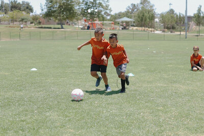Soccer Two Kids going for ball