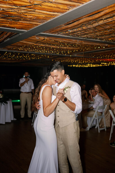 A newlywed couple's first dance at their wedding reception.