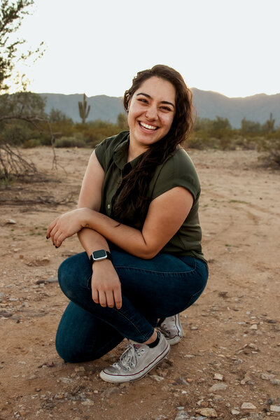 Cactus & Pine Photography owner laughing, posing for photo in Arizona desert