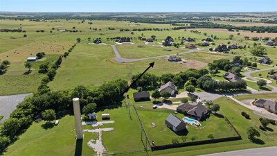 View of secluded, tree-lined lot ready for building
