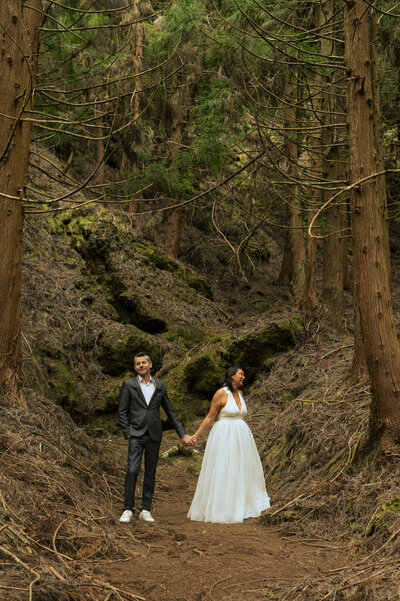 Couple cuddling and kissing in a mountain of the french alps